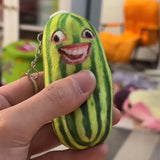 -Printed plush with attached ring for use with keys, backpack, as a zipper pull, etc. This item ships from abroad and averages 2-3 weeks for delivery to the USA. green cucumber keychain plush weird freaky face wtf watermelon striped pickle novelty toy gift -