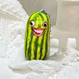 -Printed plush with attached ring for use with keys, backpack, as a zipper pull, etc. This item ships from abroad and averages 2-3 weeks for delivery to the USA. green cucumber keychain plush weird freaky face wtf watermelon striped pickle novelty toy gift -