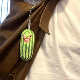 -Printed plush with attached ring for use with keys, backpack, as a zipper pull, etc. This item ships from abroad and averages 2-3 weeks for delivery to the USA. green cucumber keychain plush weird freaky face wtf watermelon striped pickle novelty toy gift -