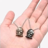Bronze Blight Gas Mask Pendant Necklace - Clockwork Century, Steampunk-In Cherie Priest's The Clockwork Century series, Leviticus Blue creates the "Incredible Bone-Shaking Drill Engine" or Boneshaker inadvertently strikes a subterranean vein of "blight gas" that turns anyone who breathes it into the living dead. Steampunk gas mask pendant in dark or antiqued bronze. Made in the USA. -