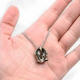 Bronze Blight Gas Mask Pendant Necklace - Clockwork Century, Steampunk-In Cherie Priest's The Clockwork Century series, Leviticus Blue creates the "Incredible Bone-Shaking Drill Engine" or Boneshaker inadvertently strikes a subterranean vein of "blight gas" that turns anyone who breathes it into the living dead. Steampunk gas mask pendant in dark or antiqued bronze. Made in the USA. -