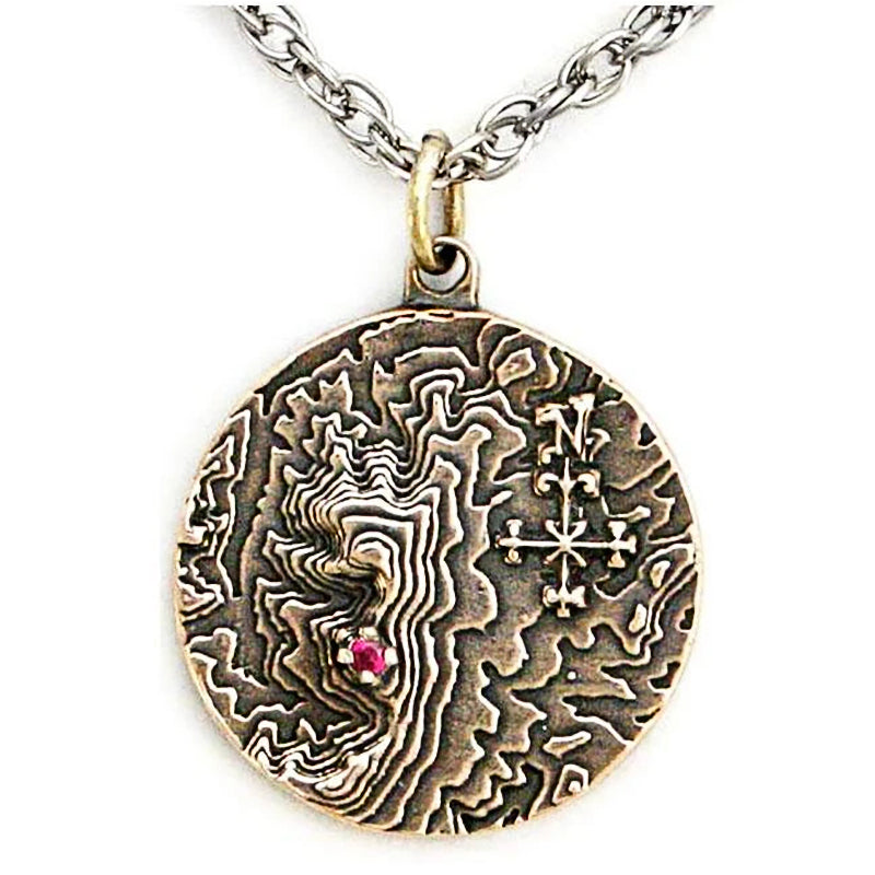 Castle Dracula Map Necklace - Great Classic Vampire Gothic Horror Gift-Solid bronze or brass medallion featuring a topographical map of the Transylvanian mountain range, a blood red imitation garnet stone marking the location of Castle Dracula, Mount Izvorul Calimanului in the Kelemen Alps, Transylvania Romania bordering Moldavia / Moldova. Official Bram Stoker jewelry. Made in USA. -Antiqued Bronze-24" Stainless Steel Curb Chain-
