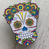 -Lady Sugar Skull soft enamel pin. She has lots of detailed features filled in with bright colors and a lovely floral head piece. Soft enamel pin measuring approximately 1.5in with 2 posts and rubber pin back. Shipped from the USA. Halloween dia de los muertos pinback bag backpack hat accessory badge g-
