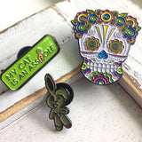 -Lady Sugar Skull soft enamel pin. She has lots of detailed features filled in with bright colors and a lovely floral head piece. Soft enamel pin measuring approximately 1.5in with 2 posts and rubber pin back. Shipped from the USA. Halloween dia de los muertos pinback bag backpack hat accessory badge g-