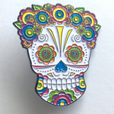 -Lady Sugar Skull soft enamel pin. She has lots of detailed features filled in with bright colors and a lovely floral head piece. Soft enamel pin measuring approximately 1.5in with 2 posts and rubber pin back. Shipped from the USA. Halloween dia de los muertos pinback bag backpack hat accessory badge g-