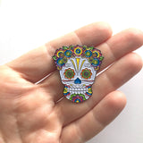 -Lady Sugar Skull soft enamel pin. She has lots of detailed features filled in with bright colors and a lovely floral head piece. Soft enamel pin measuring approximately 1.5in with 2 posts and rubber pin back. Shipped from the USA. Halloween dia de los muertos pinback bag backpack hat accessory badge g-