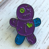-Voodoo Doll soft enamel pin with rubber pin bac. Teal and purple on black metal base. Measures approximately 1inch. Shipped from the USA. Cute funny goth gothic horror witchcraft halloween pinback badge bag backpack hat lapel accessory pin-