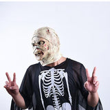 -The reanimated corpse of an unfortunate hospital patient with head bandages still in place. High quality latex over-the-head mask. One size fits most. Free shipping from abroad. Decaying decrepit medical patient zombie mummy bandaged head halloween costume cosplay asylum hospital haunted house larp-