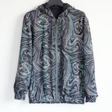 -Quality hi-vis hooded jacket with rainbow reflective paint swirl pattern. Zipper front hoodie, pockets, drawstring hood. Muted appearance in daylight, highly reflective in dusk and dark. Free shipping. Night safety jogging running walking biking safe rave streetwear unique high visibility designer clubwear fashion-