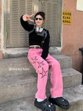 -Retro vintage women's light wash denim jeans in pink with high waist, zipper fly and wide stovepipe legs. Detailed with three, black hollow stars with elongated upper point on the outside of each leg. See size chart.
y2k streetwear alternative punk rave goth emo club 90s mall fashion -