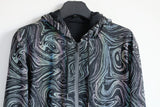 -Quality hi-vis hooded jacket with rainbow reflective paint swirl pattern. Zipper front hoodie, pockets, drawstring hood. Muted appearance in daylight, highly reflective in dusk and dark. Free shipping. Night safety jogging running walking biking safe rave streetwear unique high visibility designer clubwear fashion-