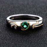 Legend of Zelda Sterling Silver Breath of the Wild Kokiri Emerald Ring-High quality ring inspired by the Kokiri's Emerald and Sheikah Slate. Handcrafted in .925 sterling silver with 18K gold plated accents and set with emerald green and clear CZ crystals. Brand new in jeweler's ring box. Not to be confused with some of the cheap metal alloy knock-offs. Free Shipping Worldwide.-