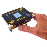 -A tiny working, miniature version of the original 1980s classic 'cocktail table' style PacMan arcade game cabinet that fits in the palm of your hand. Hi-res screen, joystick & buttons. Complete gameplay with authentic graphics and sounds. World's smallest version! Officially licensed Namco product. Shipped from USA. -