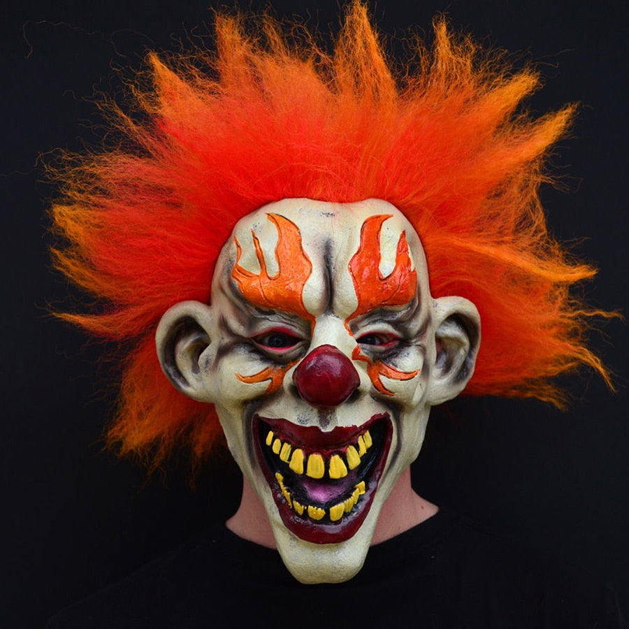 -An evil clown who just wants to watch the world burn... squinting, mouth wide with murderous laughter and appropriately flared makeup and flame-like hair. Full over the head latex mask. One size fits most. Free shipping. Halloween costume cosplay horror laughing fire murder clown circus carnival hell demon devil -