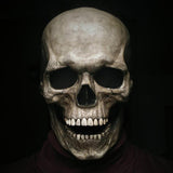 Realistic Moving Jaw Skull Mask - Full Head, Soft or Hard Latex, USA-Full head, realistic skeleton mask with mechanism which allows your mouth to move the jaw. Available in both bone white and antiqued, hard or soft latex. Ideal for any skeletal cosplay or Halloween costume.One size fits most. Ships from the USA. Horror movable advanced deluxe goth gothic creepy spooky prank grim reaper-