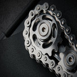 -Metal bicycle-style chain and sprocket fidget toy. Durable, high quality construction. Measures approximately 3cm x 6cm / 1.2 x 2.4 inches. Free shipping from abroad. Typically arrives in about 2-3 weeks. Unique different spinning link chain and gear anxiety diffusing perpetual motion machine toy-