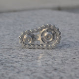 -Metal bicycle-style chain and sprocket fidget toy. Durable, high quality construction. Measures approximately 3cm x 6cm / 1.2 x 2.4 inches. Free shipping from abroad. Typically arrives in about 2-3 weeks. Unique different spinning link chain and gear anxiety diffusing perpetual motion machine toy-