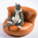 -Nicely detailed 1:6 scale fat cat figurine with faux leather sofa display stand. Cat is crafted in high quality resin and measures approximately 7.5 cm / 2.9 inches tall. New in box, guaranteed quality. Free shipping. Funny sweet realistic collectible 1/6 orange black white brown gray tabby kitty figure gift -