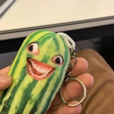 -Printed plush with attached ring for use with keys, backpack, as a zipper pull, etc. This item ships from abroad and averages 2-3 weeks for delivery to the USA.

green cucumber keychain plush weird freaky face wtf watermelon striped pickle novelty toy gift -H01-