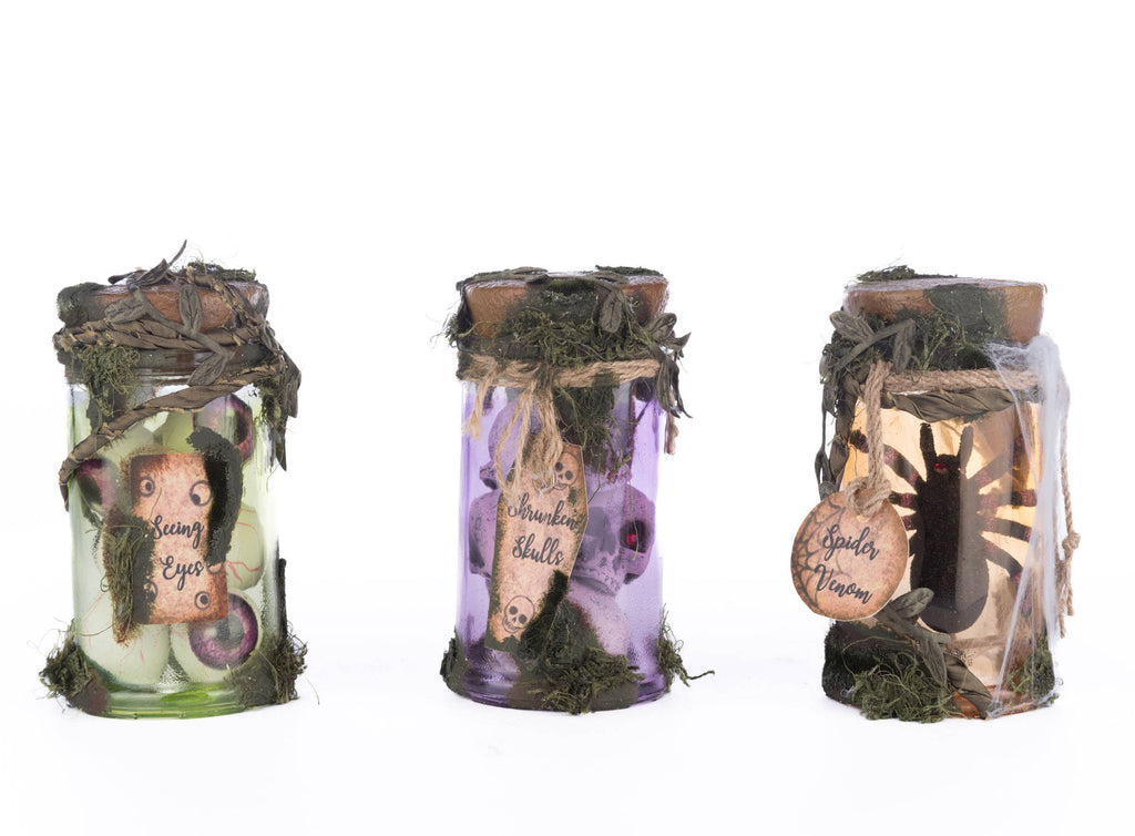 -Add some magic to your home decor with this set of three, limited edition Broomstick Acres Potion Jars! Handmade, 5.5" jars sculpted from glass and resin, filled and adorned with lifelike details. Perfect for year round Halloween or witchy decor. 

witch wizard wizardry witchcraft haunted house Katherine's Collection-810074127202