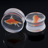 Goldfish Acrylic Tunnel Earrings, Funny Gauged Piercing Ear Tunnels-Liquid filled, acrylic gauged tunnel ear plugs with goldfish design. A fun, unique look. Sold in matching pairs and available from 10mm to 25mm. These earrings ship from abroad and typically arrive in about 2-3 weeks. Funny unique weird fish earrings jewelry look punk freak fashion style look harajuku fishbowl-