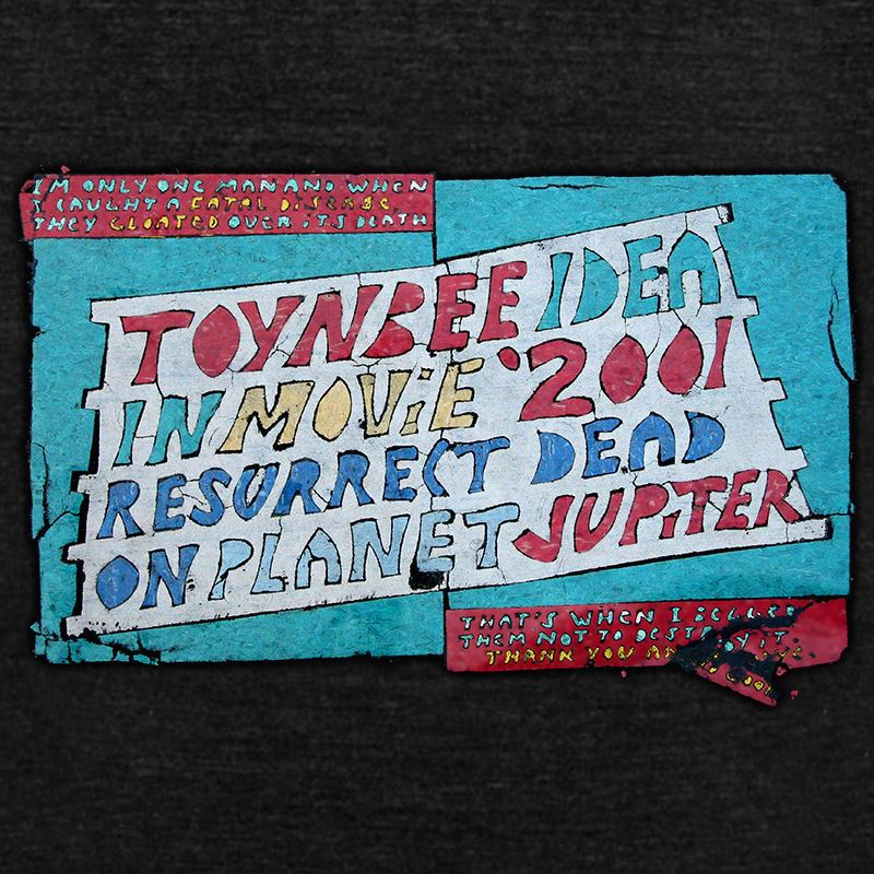 Toynbee Tile Women's Shirt - Cryptic Sci-Fi Street Art Mystery-Witness Toynbee Idea Resurrected From Dead Streets.No longer one man. We are the media. Thank you and goodbye.TOYNBEE IDEA IN MOVIE 2001 RESURRECT DEAD ON PLANET JUPITER –– Womens fashion fit fine cotton or poly blend graphic tees. These shirts are made to order and typically ship in 3-5 business days.-