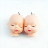-Uniquely creepy vintage style babydoll head earrings. Free Shipping Worldwide. These ship from abroad and typically arrive in about 2 weeks. Funny weird emo goth gothic harajuku punk baby doll head drop / dangle earrings. -Lips-