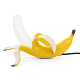 Banana Lamps, Modern Italian Pop Art Designer LED Lighting-Unique Italian designer modern pop art banana LED table lamps. Resin and glass in 3 poses with realistic yellow or gold metallic finish. AC power with switch, 90-260v, 0-5w, CC CE EMC certified. Free shipping. 

Fun playful mod home decor high end design desk living room bedroom studio flat apartment kids weird is good-Realistic Laying-