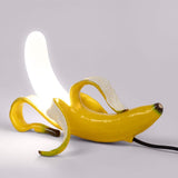 Banana Lamps, Modern Italian Pop Art Designer LED Lighting-Unique Italian designer modern pop art banana LED table lamps. Resin and glass in 3 poses with realistic yellow or gold metallic finish. AC power with switch, 90-260v, 0-5w, CC CE EMC certified. Free shipping. 

Fun playful mod home decor high end design desk living room bedroom studio flat apartment kids weird is good-