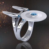 -Federation starship shaped silver plated ring with cubic zirconia stones. Free shipping from abroad with average delivery to the US in 2-3 weeks.

Trekker Trekkie USS Enterprise NCC NX fashion jewelry fan gift space universe scifi sci-fi science fiction TNG OS -