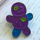 -Voodoo Doll soft enamel pin with rubber pin bac. Teal and purple on black metal base. Measures approximately 1inch. Shipped from the USA.

Cute funny goth gothic horror witchcraft halloween pinback badge bag backpack hat lapel accessory pin-