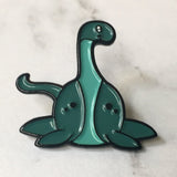 -Cute, soft enamel Lochness Monster pin with rubber pin back from the Cryptid Collection. Measures approximately 1inch. Shipped from the USA. © LaBranche Designs, LLC

kawaii cryptozoology mythology urban legend pinback badge brooch jewelry bag backpack hat accessory-