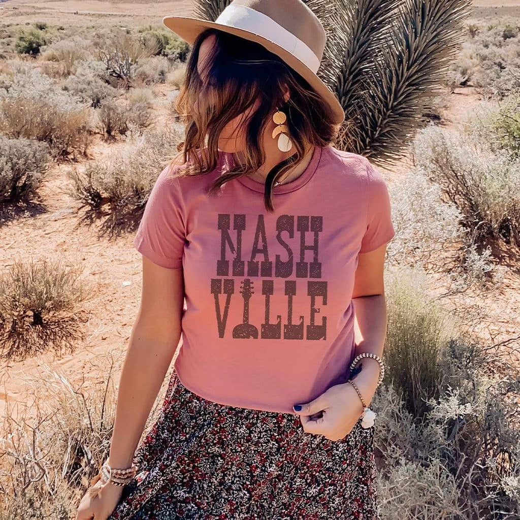 -Vintage faded tees with a modern twist! Ultra-soft, premium triblend or 50/50 poly cotton blend unisex shirts. Eco-friendly, water-based inks for a graphic print that is soft to the touch. Shipped from the USA. Nashville retro graphic big text nash ville womens juniors mens TN Tennessee summer fashion-