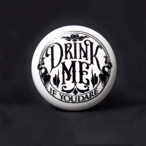Alchemy Gothic DRINK ME Bottle Stopper, Ceramic and Cork -Drink Me... If You Dare! For adventurous spirits, or to make liquor thieves think twice before tipping your favorite with this bottle stopper from Alchemy Gothic of England. Ceramic topper with tapered cork base. Ships in 1-3 days from USA. Unique macabre fantasy wine drinking accessory gift. Alice in Wonderland Potion-