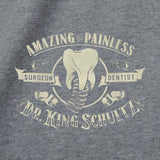 -Amazing and painless, unless you have wronged him in some way. Thanks to a fortuitous turn of events, it was the good doctor who unchained Django... dentist turned bounty hunter Dr. King Schultz. Fitted juniors tee with screenprinted design incorporating spring-mounted molar tooth from his dental wagon. Ships from USA.-