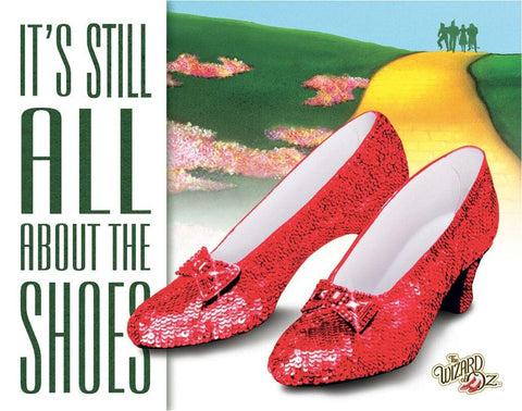 Wizard of Oz It's Still All About The Shoes Metal Tin Sign-The Wizard of Oz "It's Still All About The Shoes" ruby slippers metal sign. High quality lithograph print, scratch and rust resistant. Folded corners with holes for hanging or mounting. 16x12.5in, Officially licensed. Made in the USA. New Retro Vintage WOZ Baum MGM Movie Judy Garland Wall Art Decor Yellow Brick Road-605279119042