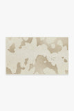 -Faux cow-hide rug in ivory and cream. -1-1/2' x 2-1/2'-