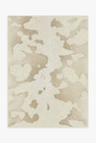 -Faux cow-hide rug in ivory and cream. -2' x 3'-