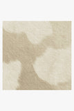 -Faux cow-hide rug in ivory and cream. -