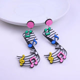 Super Eighties Music Scroll Acrylic Drop / Dangle Earrings, New Retro-A pair of eighties inspired acrylic drop / dangle earrings featuring colorful treble clef and notes.Free Shipping Worldwide. These earrings ship from abroad and typically arrive in about 2 weeks. Retro 1980s 80s New Wave pop teen fashion. Bright, cheerful and fun nostalgia kitsch design.-