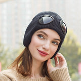 -Fashionable thick (160g) plush lined, knit polyester beanie with bomber cap style ear flaps and built in tinted goggles. Orange, black, white, green, purple, blue or yellow modern European style winter hat. A fun and functional fashion accessory for travel and outdoor activity on cold days. Free Shipping Worldwide. -Black-