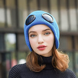 -Fashionable thick (160g) plush lined, knit polyester beanie with bomber cap style ear flaps and built in tinted goggles. Orange, black, white, green, purple, blue or yellow modern European style winter hat. A fun and functional fashion accessory for travel and outdoor activity on cold days. Free Shipping Worldwide. -Blue-