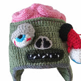 -Funny knitted acrylic laplander style zombie beanie hat with exposed brain and one eye hanging out of its socket. Free shipping.

Available in 2 sizes: small/youth/kids and large/teens/adults. 

Halloween knit hat weird gross fun zombies punk alternative novelty beanies winter fall casual costume humor pink green gift-