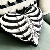 -Handmade heart-shaped throw pillow with printed ribcage design. Available in 2 sizes: Small measuring approximately 40x35cm / 15.75x13.78in and Large measuring 50x45cm / 19.7x17.72in. Free shipping.

Goth gothic home decor sewn cushion skeletal skeleton bones halloween unique creepy spooky love valentines day gift-