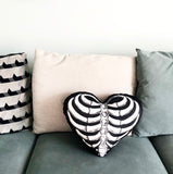 -Handmade heart-shaped throw pillow with printed ribcage design. Available in 2 sizes: Small measuring approximately 40x35cm / 15.75x13.78in and Large measuring 50x45cm / 19.7x17.72in. Free shipping.

Goth gothic home decor sewn cushion skeletal skeleton bones halloween unique creepy spooky love valentines day gift-