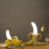 Banana Lamps, Modern Italian Pop Art Designer LED Lighting-Unique Italian designer modern pop art banana LED table lamps. Resin and glass in 3 poses with realistic yellow or gold metallic finish. AC power with switch, 90-260v, 0-5w, CC CE EMC certified. Free shipping. 

Fun playful mod home decor high end design desk living room bedroom studio flat apartment kids weird is good-