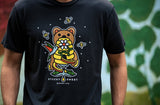 -Vintage black luxuriously soft cotton t-shirt with a classic fit & relaxed feel. Cut, sewn & garment dyed in Los Angeles with limited edition artwork from Pseudodudo featuring a bear interrupting some bees & birds at the local honey jar, a playful design inspired by the important role pollinators play in our ecosystems.-
